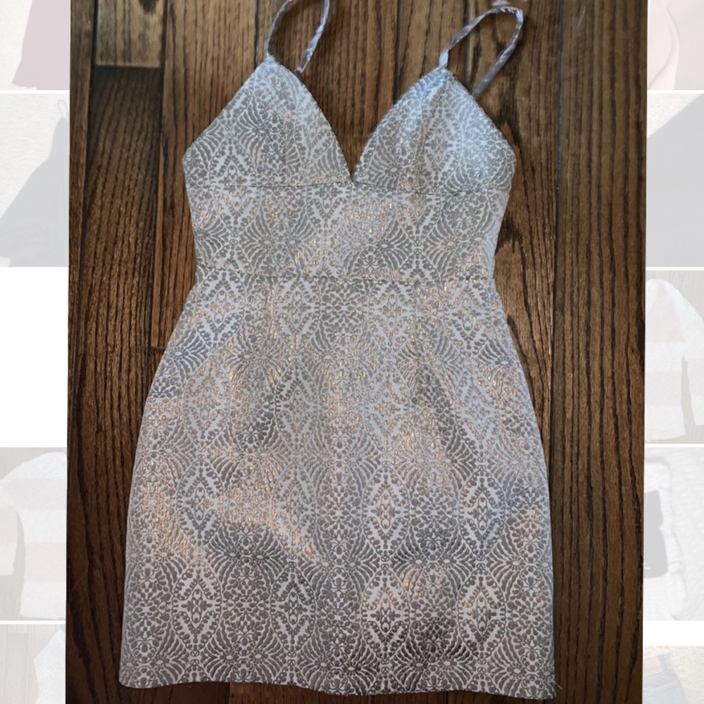 Revolve by the way. Beautiful gold & silver dress